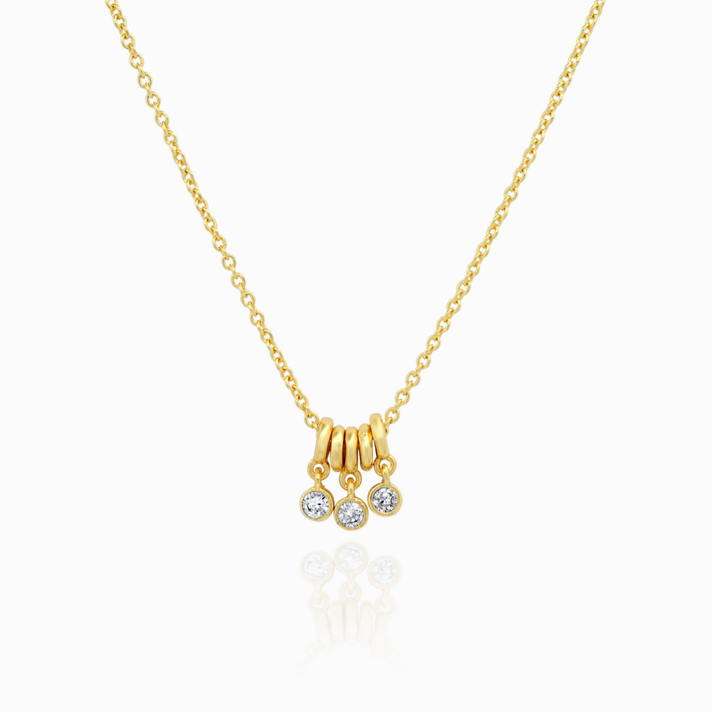 TAI NECKLACE WITH CZ AND GOLD RING CHARMS